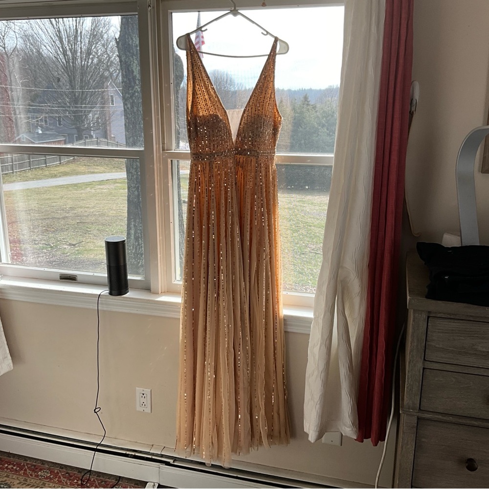 Mac Duggal gown, beautiful sequins, never worn. Size 6 fits more like size 8